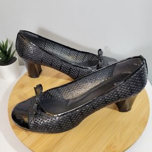 STUART WEITZMAN Captivate perforated black round toe chunky heel pumps
